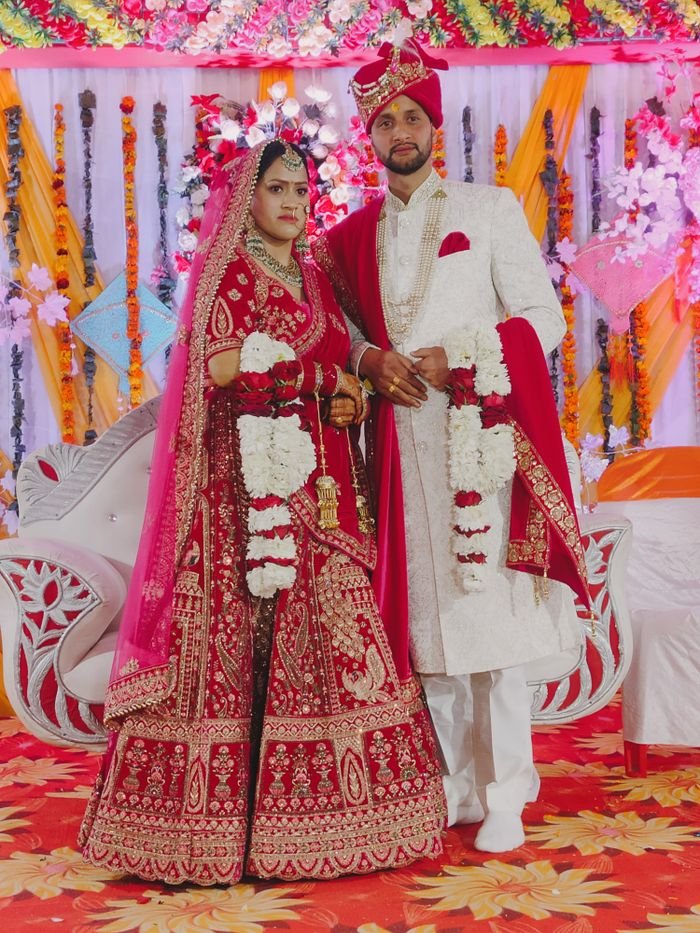 Elegant Indian couple in traditional attire at a vibrant wedding ceremony in Ukhimath.